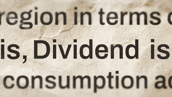 Close-up of printed text showing the word “Dividend” highlighted within a paragraph on a textured paper background.