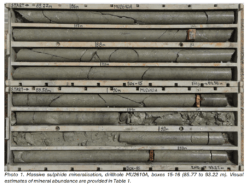 Drill core trays displaying massive sulphide mineralisation from drillhole MU2610A between 85.77 and 93.22 metres depth.
