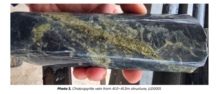 Close-up of a drill core showing a chalcopyrite vein between 41.0m and 41.3m depth in drill hole LLD0001.